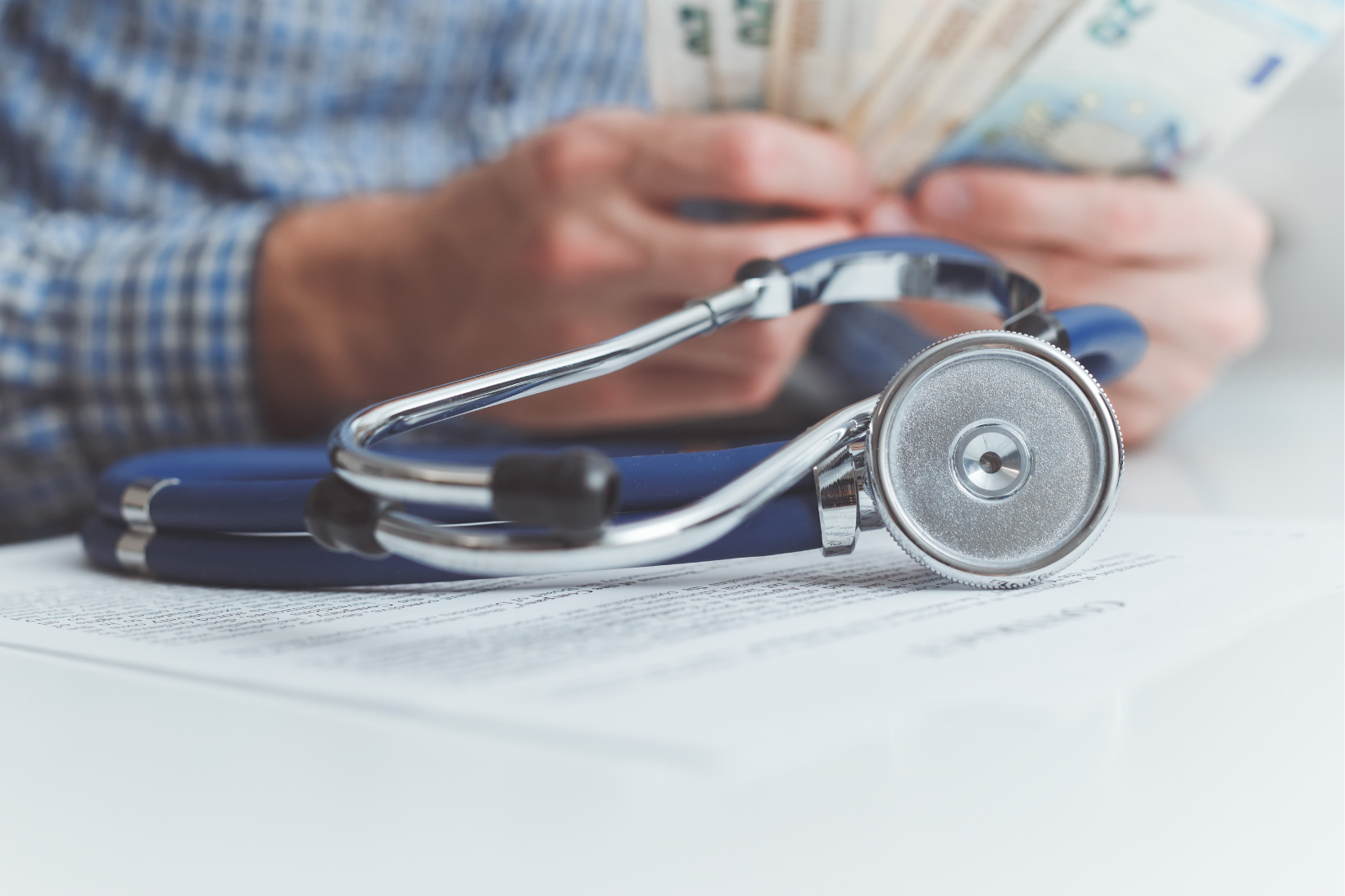 doctor-evaluating-how-medical-receptionist-benefit-healthcare-business virtual medical receptionist, what is a medical receptionist