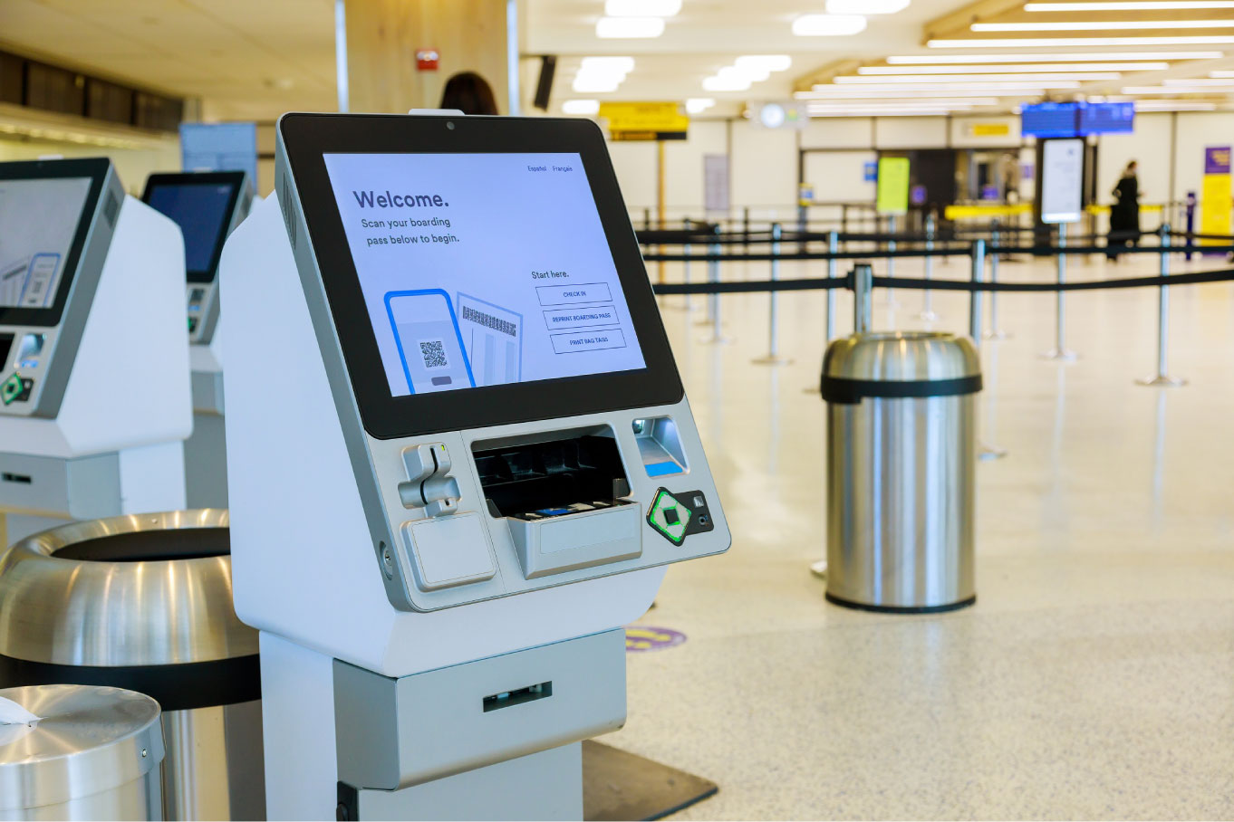Self service machine desk kiosk at airport for check in printing boarding pass and buying ticket Kiosk management system placed on an airport