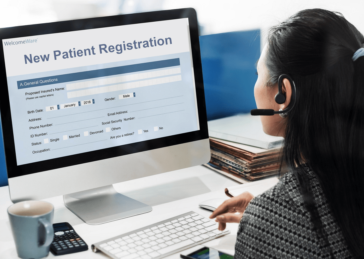 physical-therapy-receptionist-reviewing-patient-records Physical therapy receptionist reviewing patient records