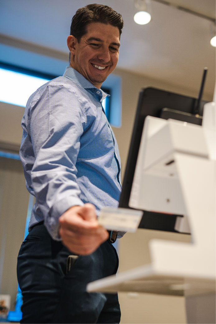 guest-using-a-check-in-kiosk-scanner
